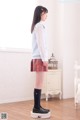 A woman standing on a hoverboard in a room.